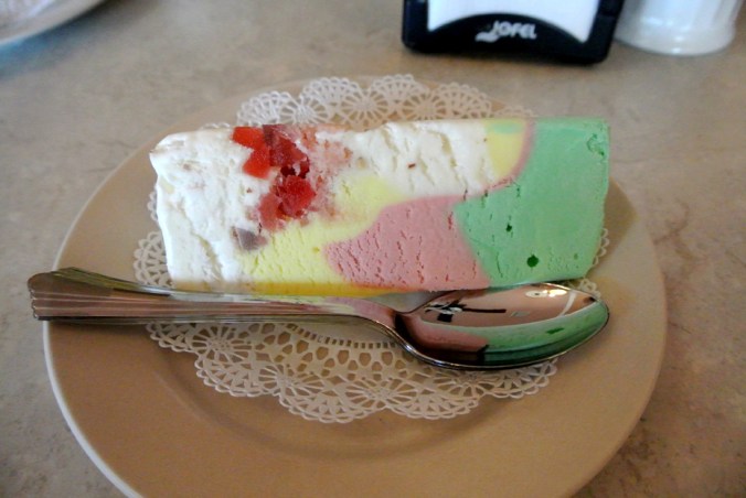 Cassata-Pistachio Almond, Tutti Frutti, and Lemon gelato with whipped cream and a bite of cake and candied fruit.